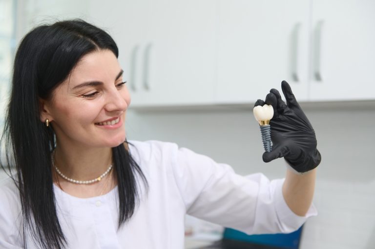 Beautiful,Woman,Dentist,,Orthodontist,,Maxillofacial,Surgeon,Smiles,,Showing,An,Enlarged