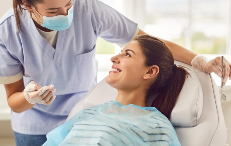 Doctor,Dentist,,Nurse,,Or,Orthodontist,Conducting,A,Dental,Examination,For